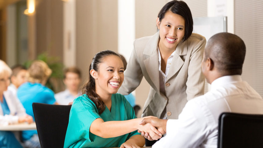 Hospital employee and nurse at job interview