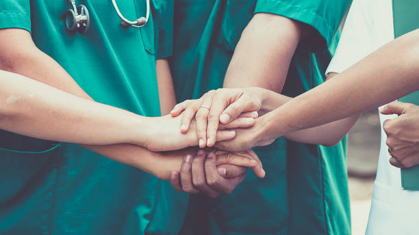 Doctors and nurses coordinate hands. Concept Teamwork